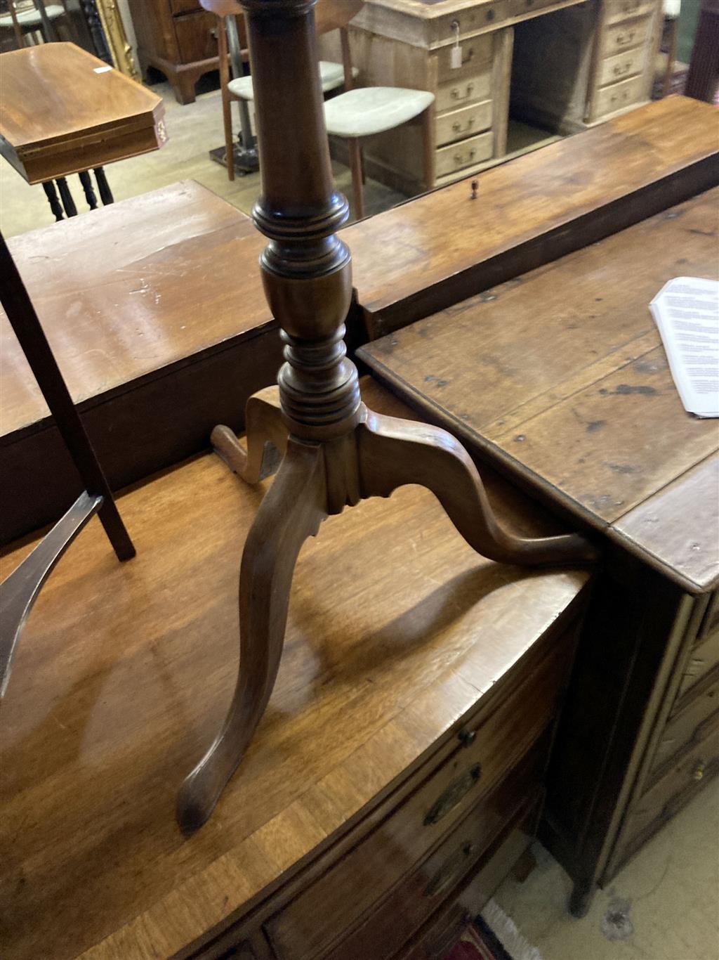 A George III mahogany corner washstand, width 58cm, depth 40cm, height 83cm together with a circular mahogany tripod wine table, diamet